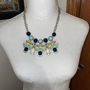 Silvertone bib necklace with green, navy, yellow, white and crystal stones